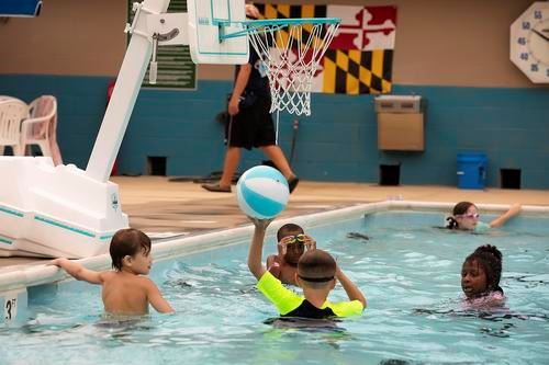 Kids playing basketball in Kings Landing Pool