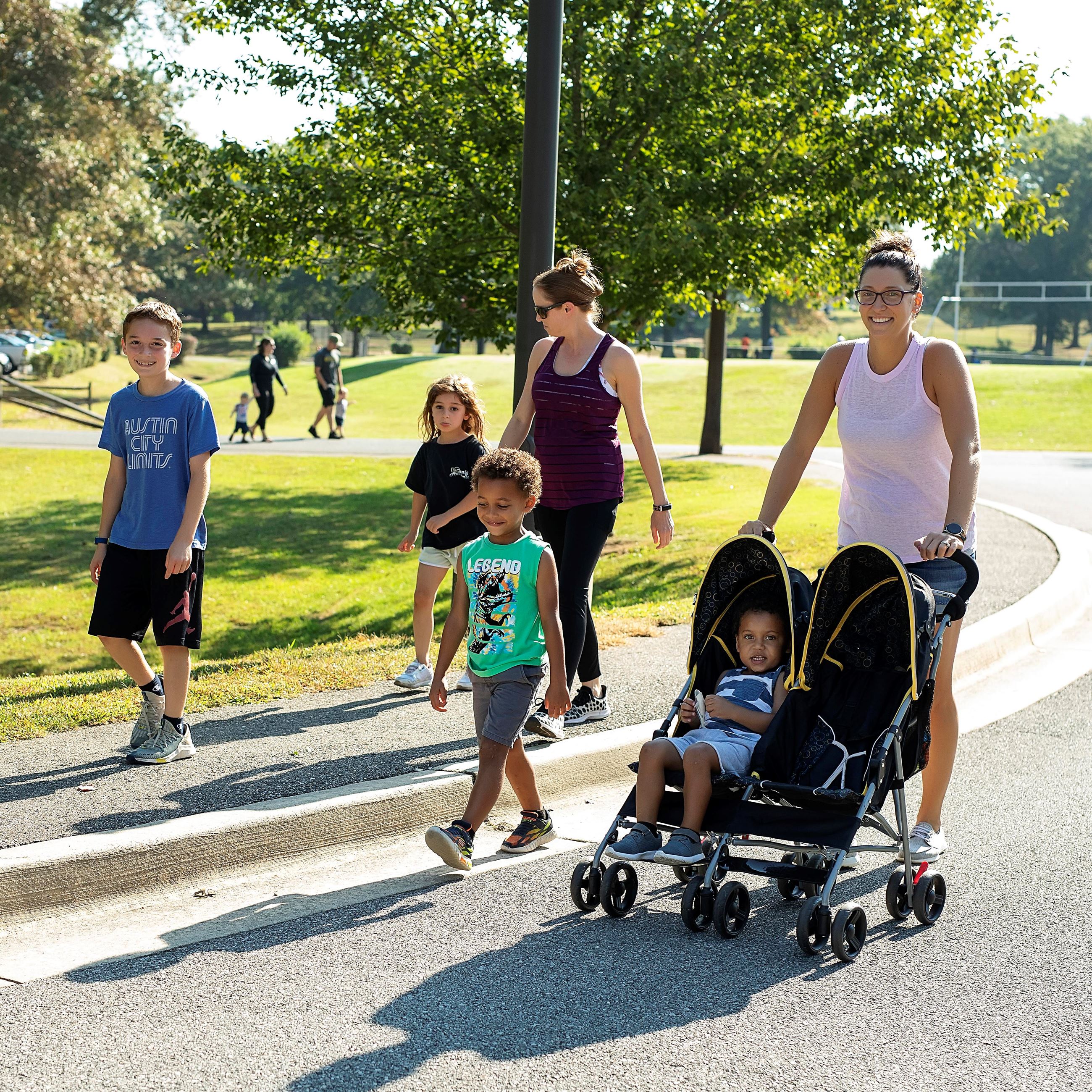 Family walking on a path at Dunkirk District Park