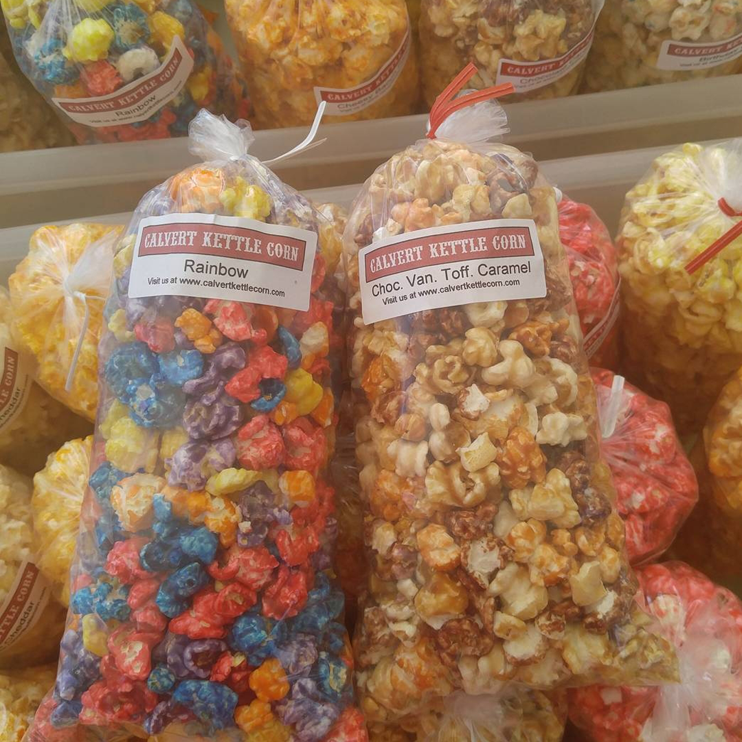 Rainbow and chocolate vanilla toffee caramel flavored bags of Kettle Corn