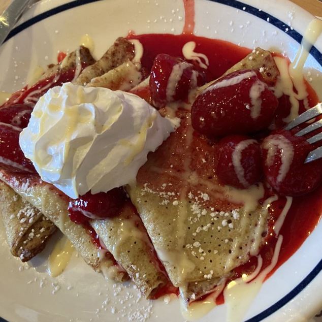 Strawberry crepes with whipped cream