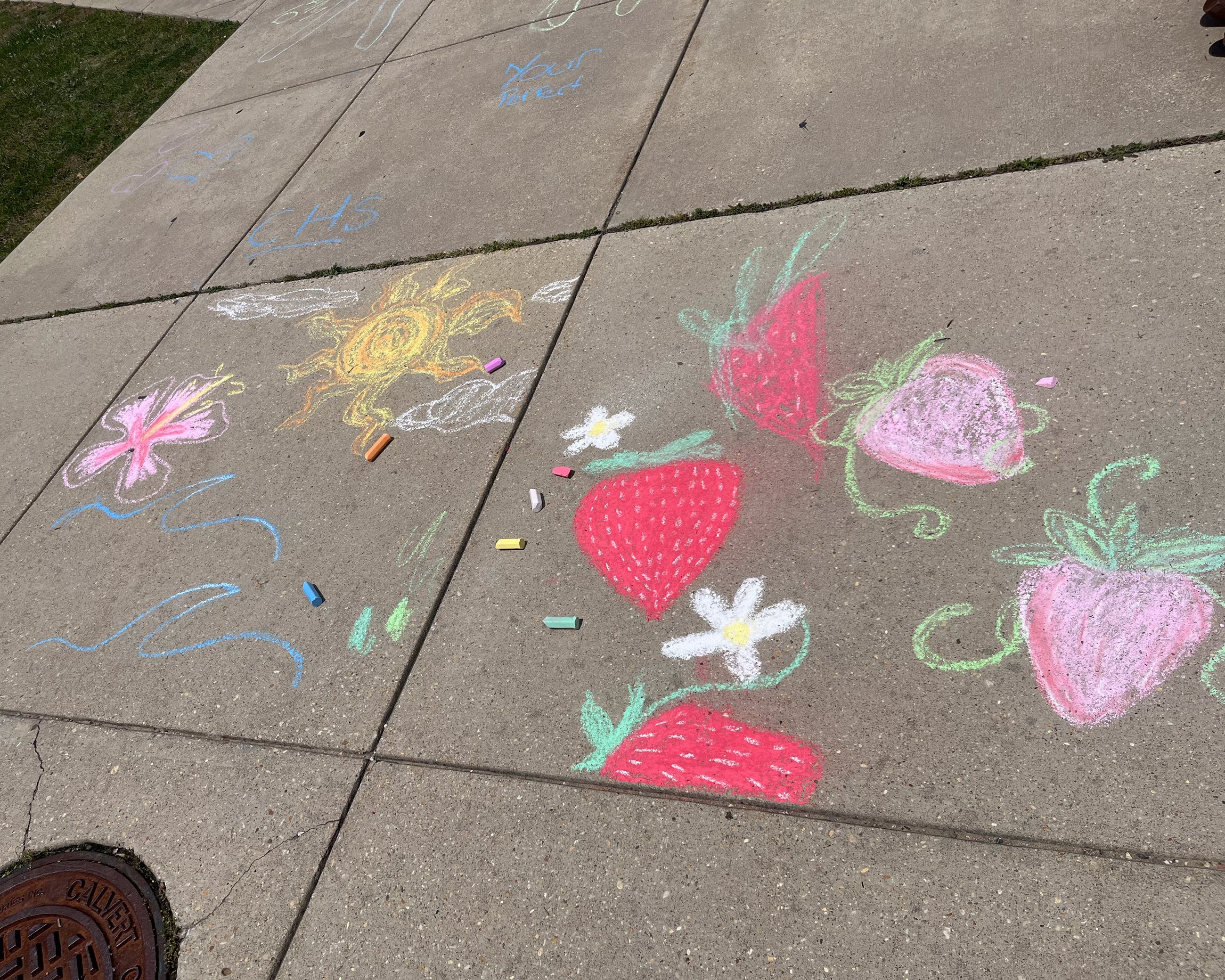 Multicolored chalk art of a sunflower with text "You are amazing."