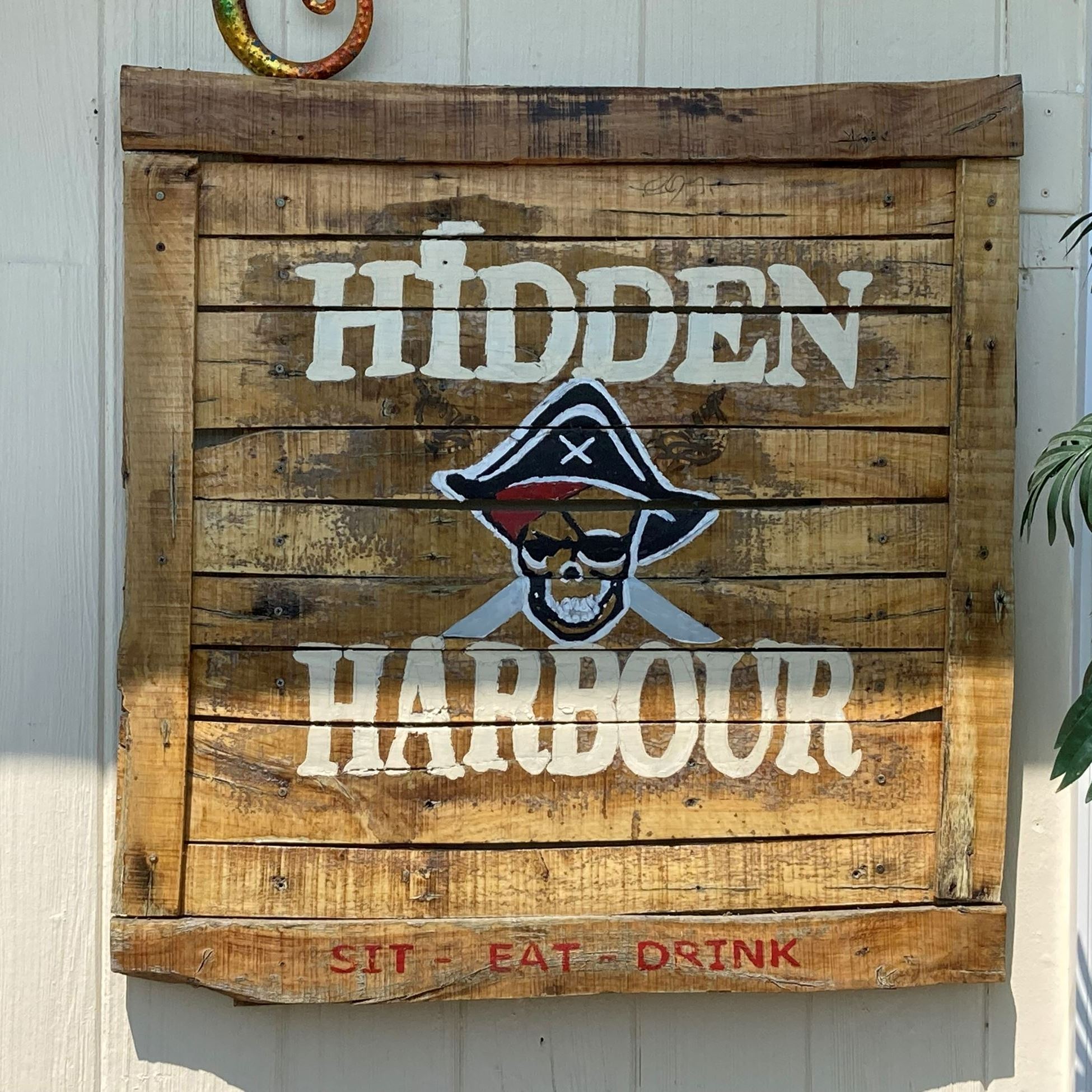 wooden sign for Hidden Harbour restaurant
